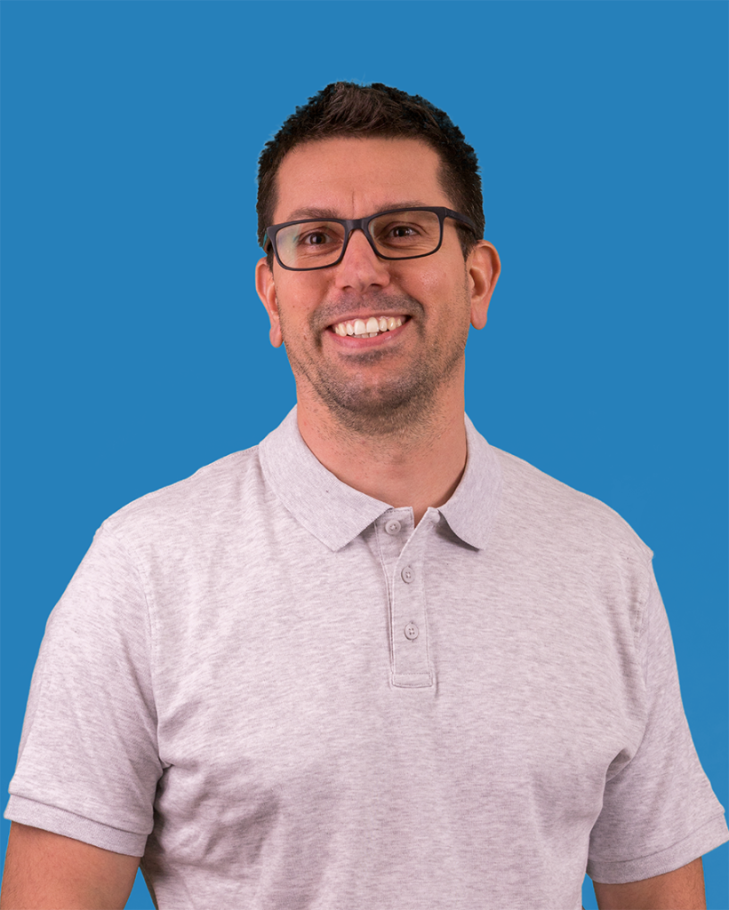 pistike smiling corporate photo with blue background
